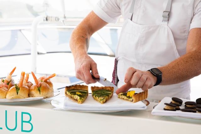 gourmet food being served by luxury yacht crew members