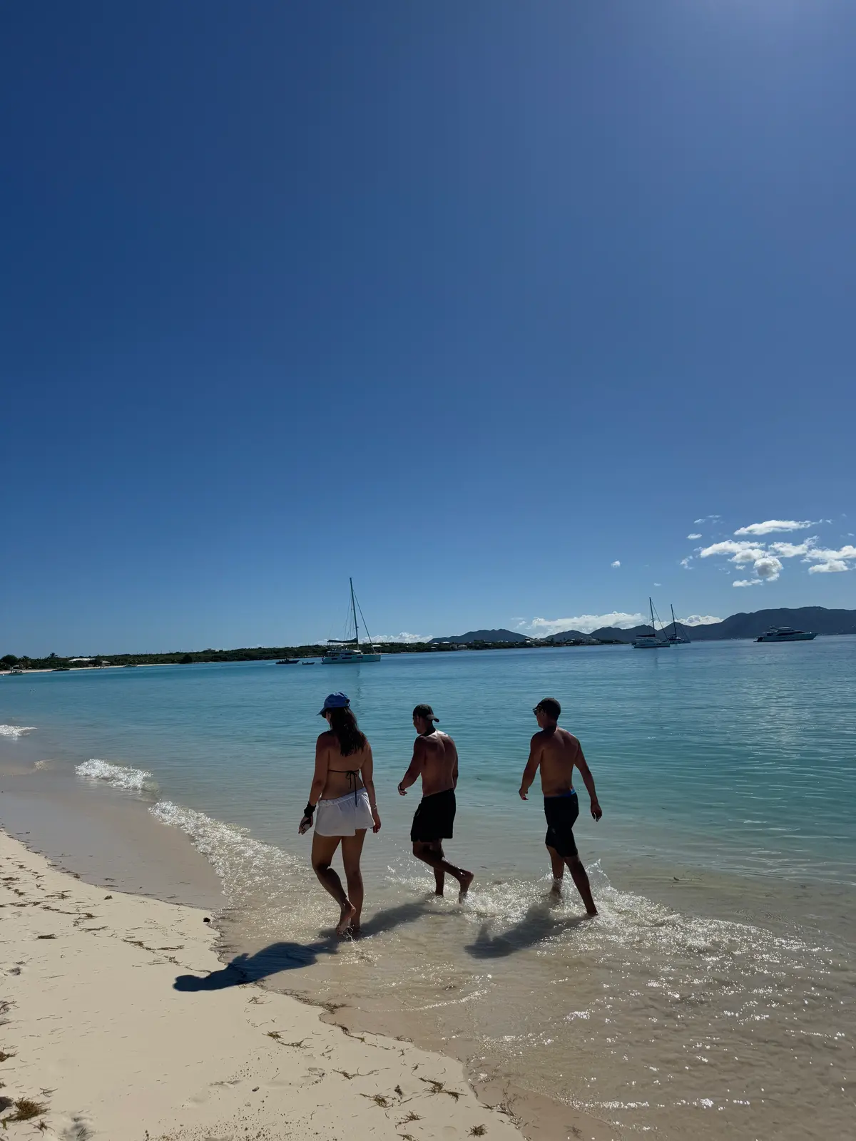 Walking into the water off an Anguilla beach