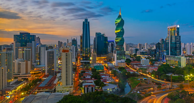 The colorful panoramic skyline of Panama City at sunset with high rise skyscrapers