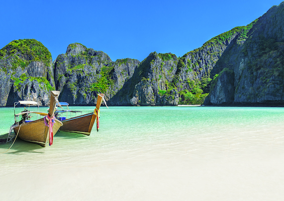maya bay in thailand with small boats docked on sea