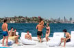 Group of people lounging on mischief yacht swim platform