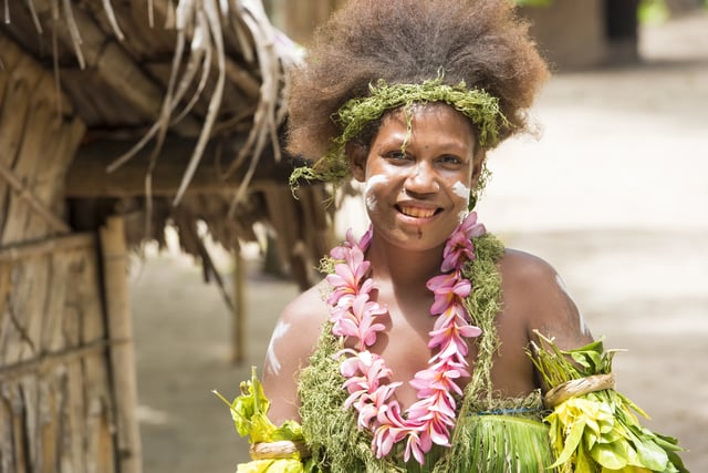 Solomon Islands, beautiful woman dressed in flowers and leaves