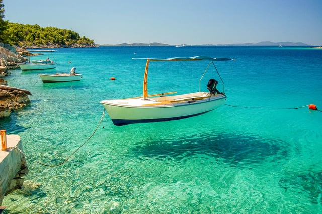 Picturesque scene of boats in a quiet bay of Milna on Brac island, Croatia