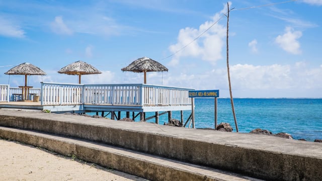 Sea swimming area and sun beach umbrellas by the Faleapuna area
