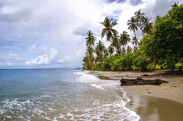 Debris on Mbonege beach, a popular wreck diving destination near Honiara, Solomon Islands