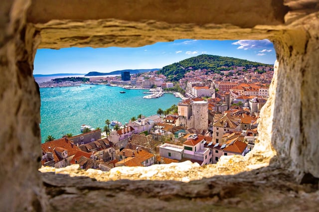 Split bay aerial view through stone window, Dalmatia, Croatia