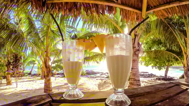 Half full glasses of tropical pina colada