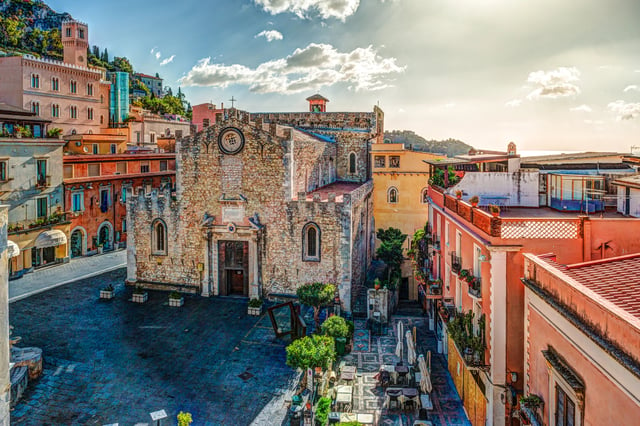 Townscape of Taormina with cathedral and hillside buildings