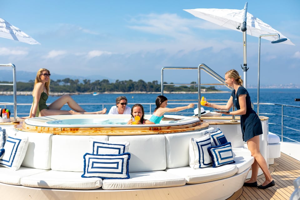 family in a hot tub on a superyacht