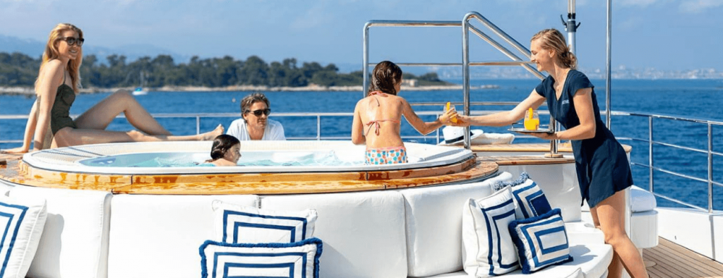 family in jacuzzi luxury yacht cairns