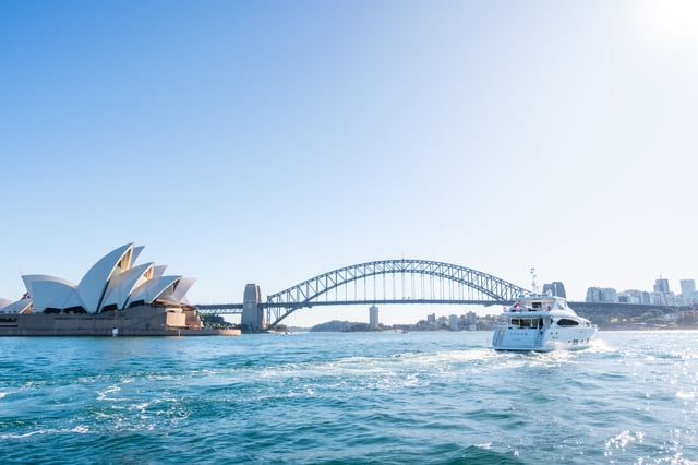 view of sydney harbour bridge with superyacht